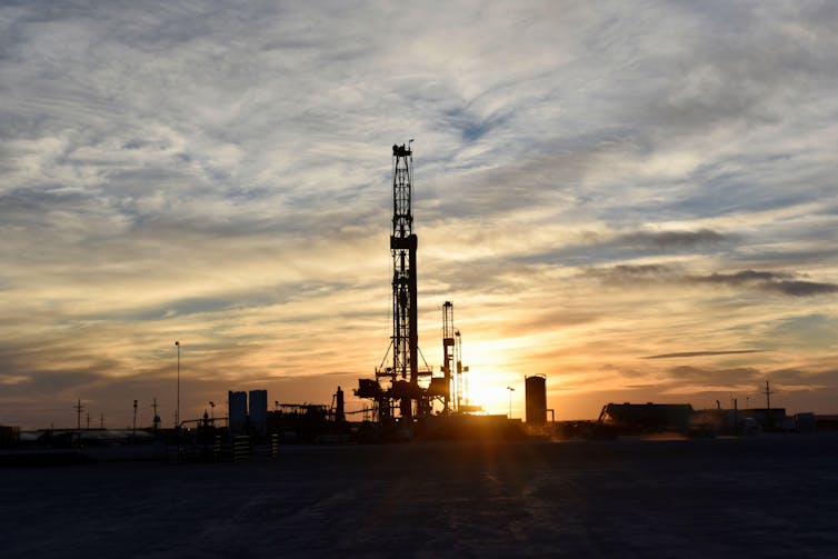 Industrial equipment at sunset