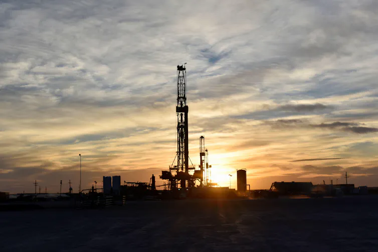 Industrial equipment at sunset