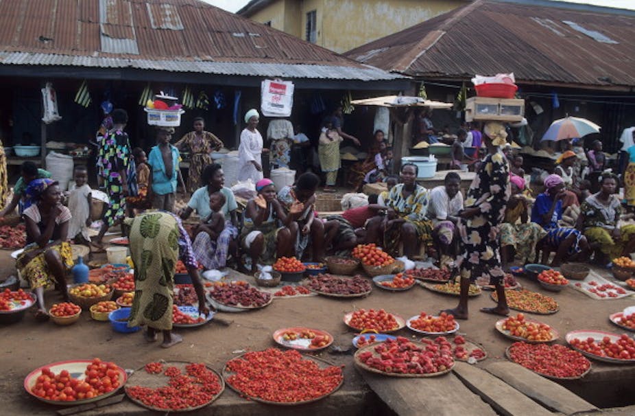 Women and their wares at an open market
