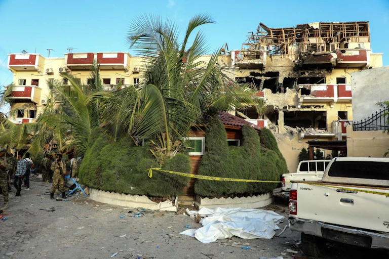 A three-storey hotel with some parts of the structure destroyed.