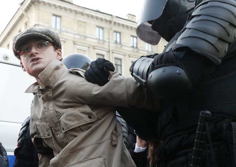 A young man is arrested at a mobilization protest in St. Petersburg.