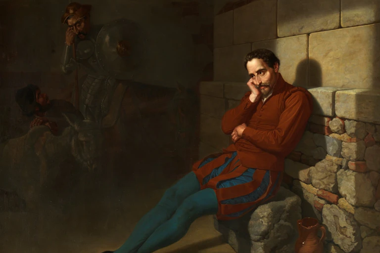 Un hombre pensativo imagina las presencias del Quijote y Sancho.