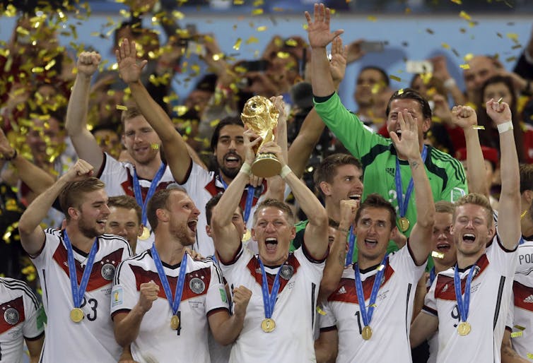 German players hold 2014 World Cup trophy aloft