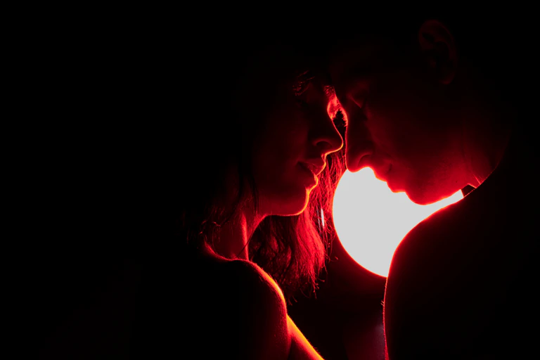 man and woman by red light