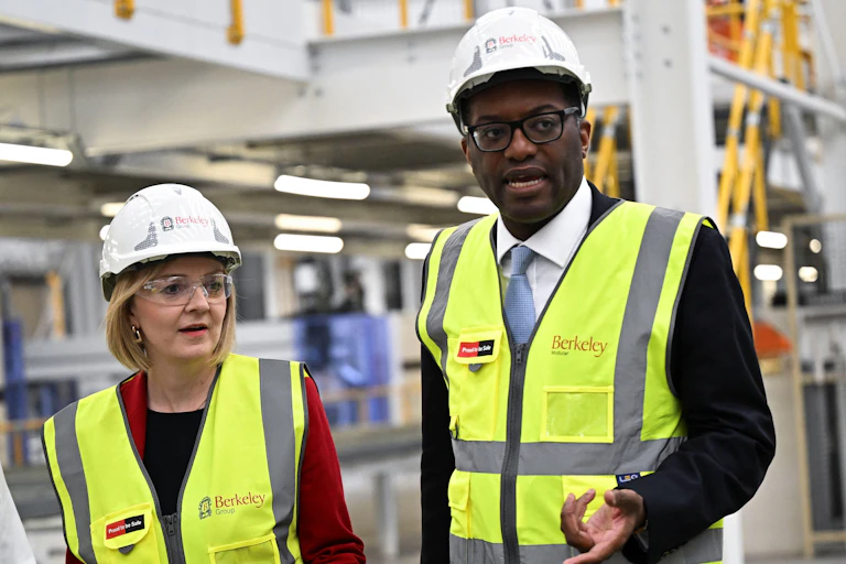 Liz Truss and Kwasi Kwarteng in hard hats and high-vis vests, factory visit, September 23 2022