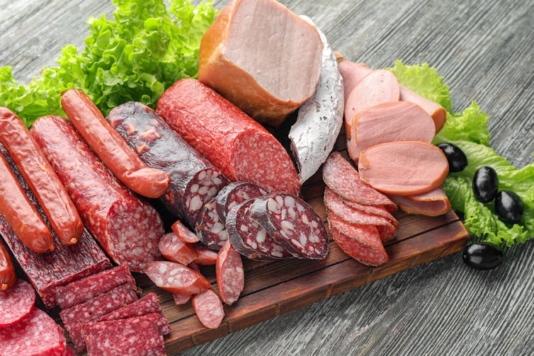 A charcuterie board of processed meats.