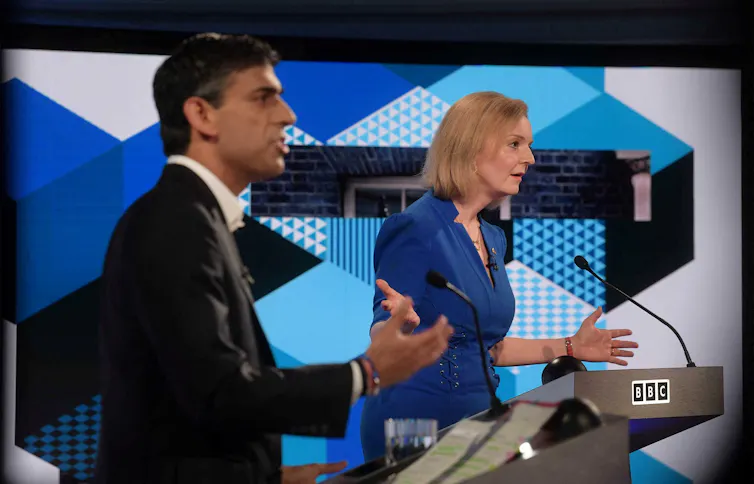 Rishi Sunak and Liz Truss speaking at podiums during a leadership debate.