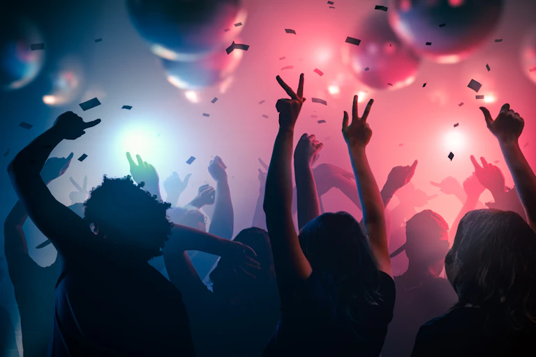 Graphic image of people dancing in a club against a pink and blue lit ceiling.