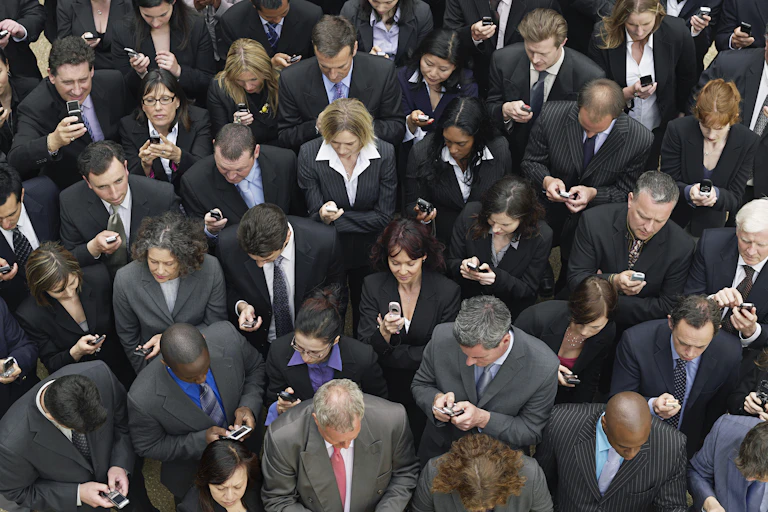 Crowd of people using phones