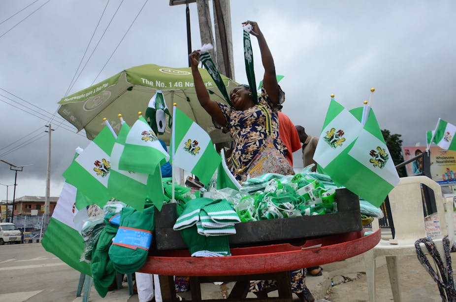 A woman selling Nigerian flags.
