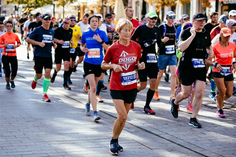 A pack of runners taking part in a marathon.