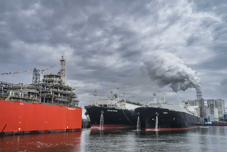 Two large vessels in a port.