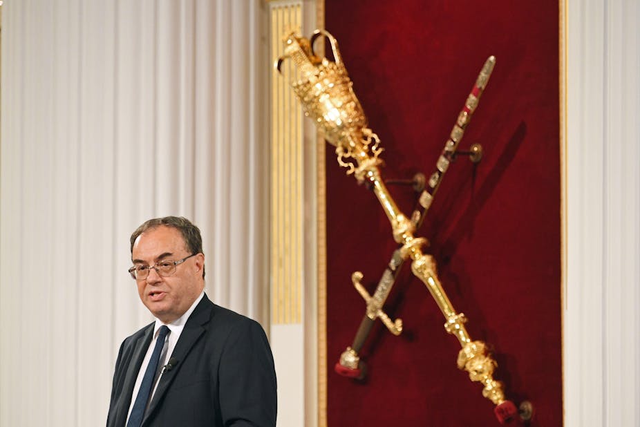 Andrew Bailey giving a speech next to a royal sceptre