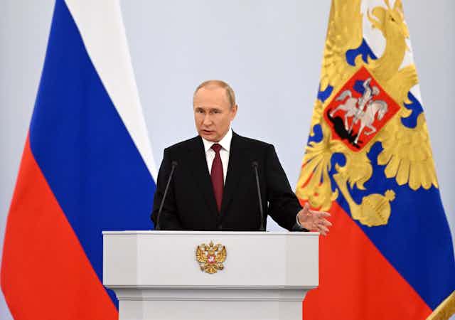 Russian President Vladimir Putin speaks during a ceremony to sign treaties on new territories' accession to Russia at the Grand Kremlin Palace in Moscow