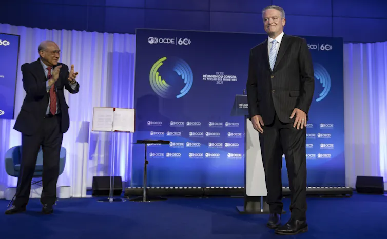 Outgoing OECD secretary-general Jose Angel Gurria with successor Mathias Cormann at the handover ceremony in Paris in June 2021.