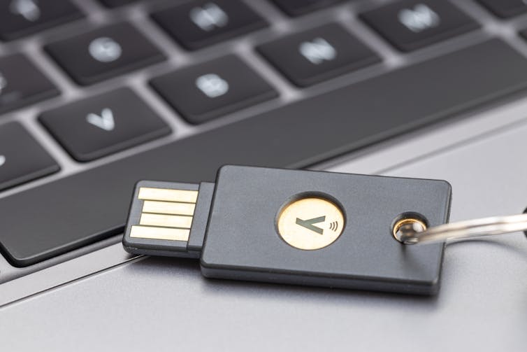A small usb-key like device with a golden y symbol on it