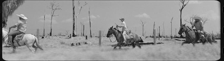 Three cowboys on horses