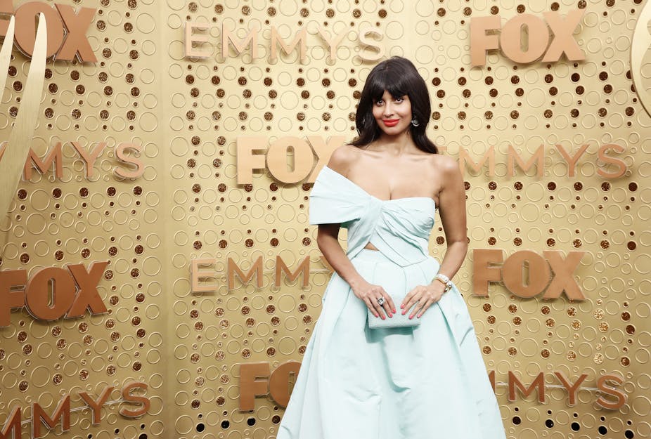 Actress Jameela Jamil poses on the red carpet.