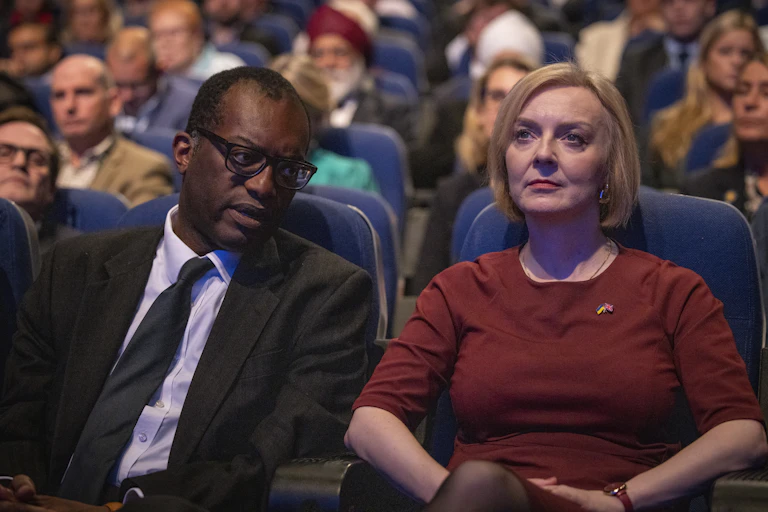 Kwasi Kwarteng, Liz Truss in the front row of an audience at the Conservative Party Conference, October 2022