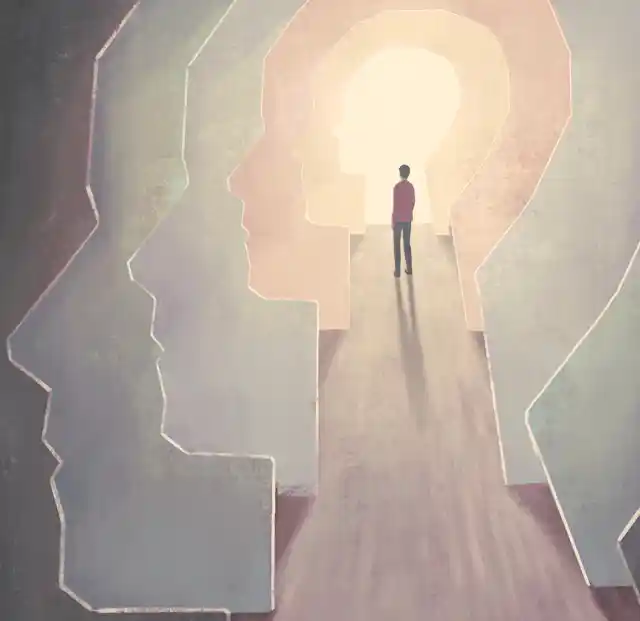 Concept art person within numerous heads.