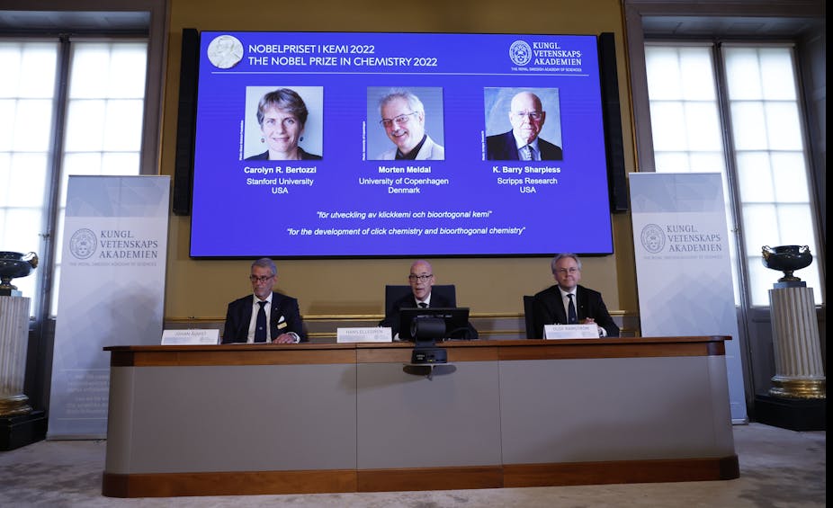Image from the Nobel announcement, with the winners on a screen behind the committee.