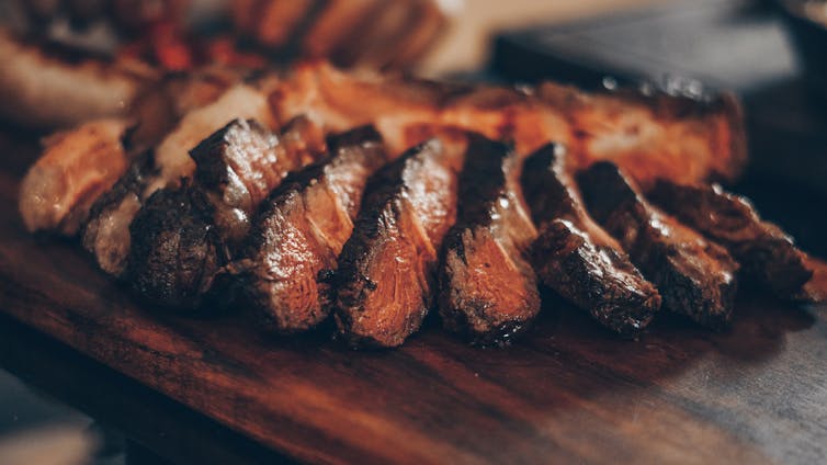 Slices of beef on a chopping board