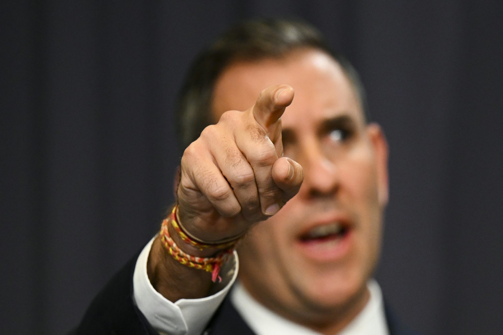 Man pointing while speaking