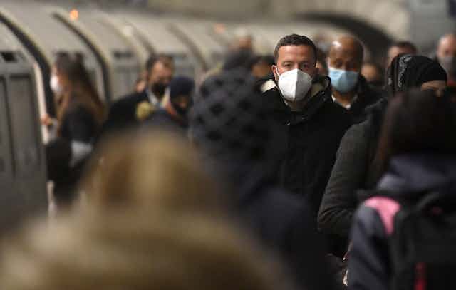 Passengers wearing masks in London's underground.