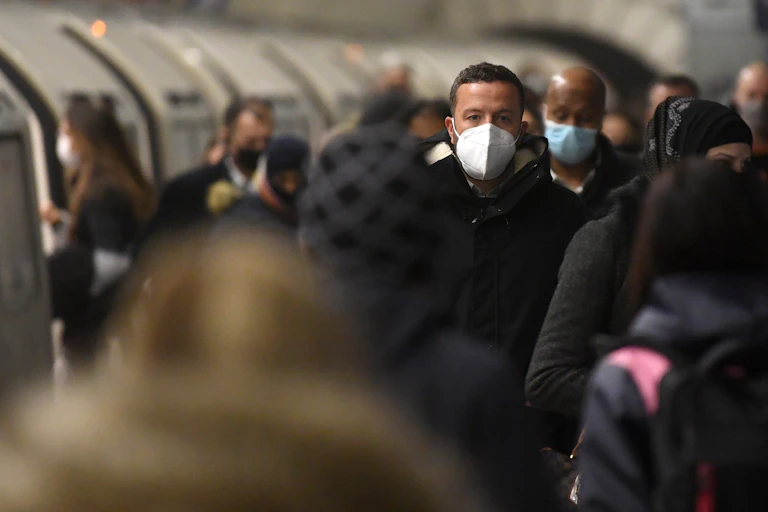 Passengers wearing masks in London's underground.