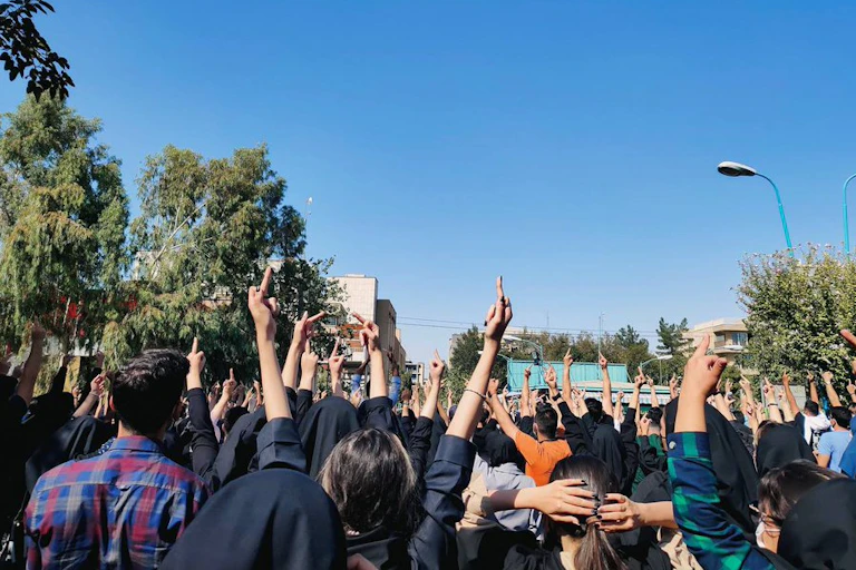 Photograph of student protests in Isfahan, Iran, taken from the back to avoid identification.
