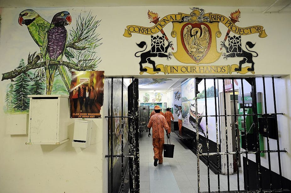 Prisoners walk in a corridor 