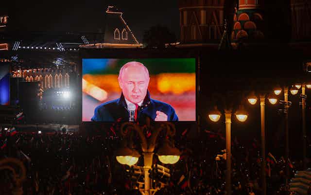 A video screen in Red SQuare, Moscow, shows Vladimir Putin announcing the annexation of four areas of Ukraine.