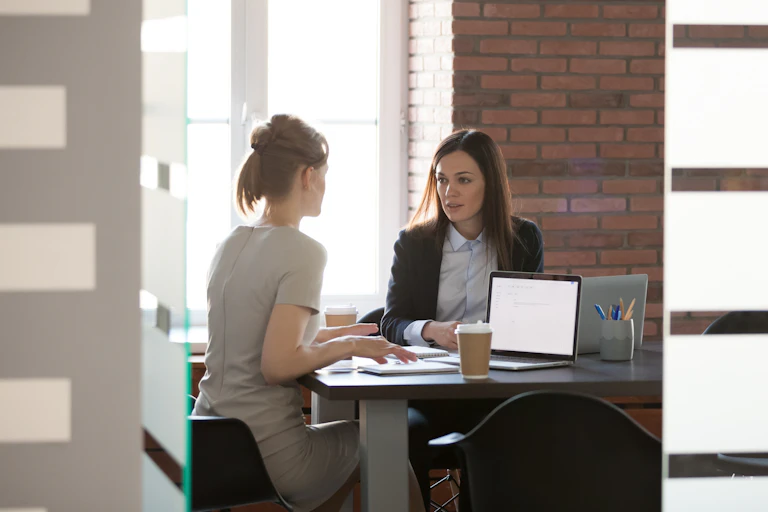 Meeting between two women at work
