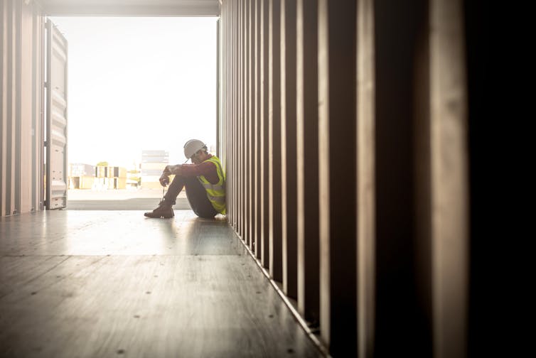 Builder sitting at the end of a corridor