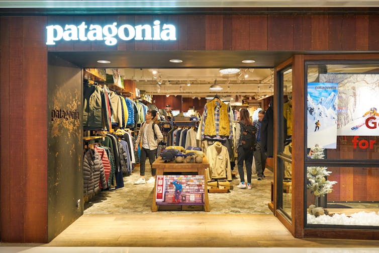 A shopper browsing the racks of a Patagonia store