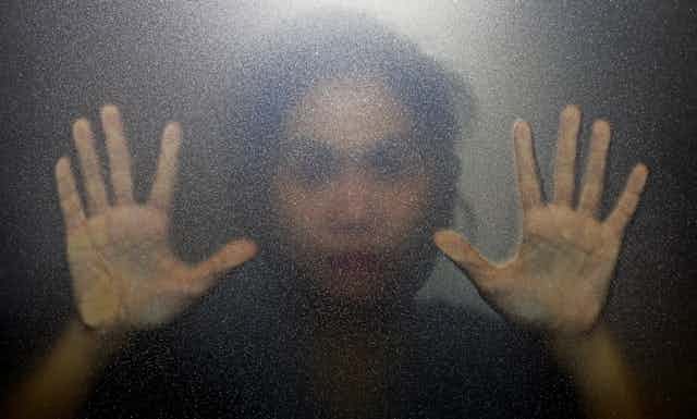 Woman's blurred face and hands