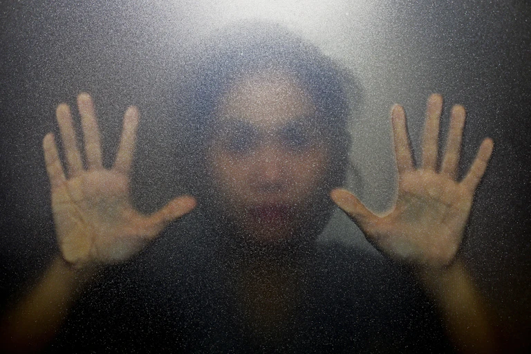 Woman's blurred face and hands
