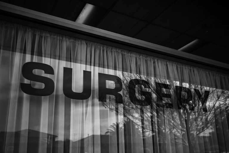 Surgery sign on glass window