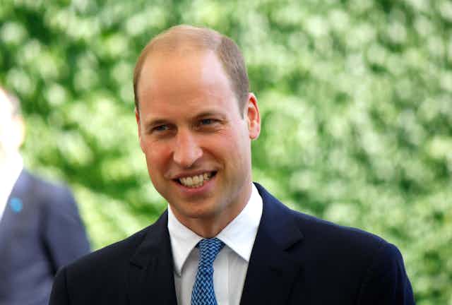 Prince William in blue suit.