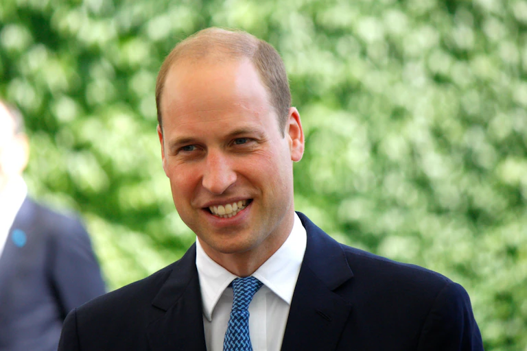 Prince William in blue suit.