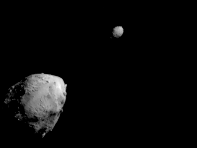 Two gray rocks in space.