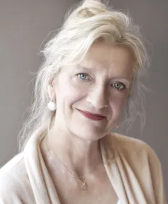 A smiling attractive middle-aged woman.