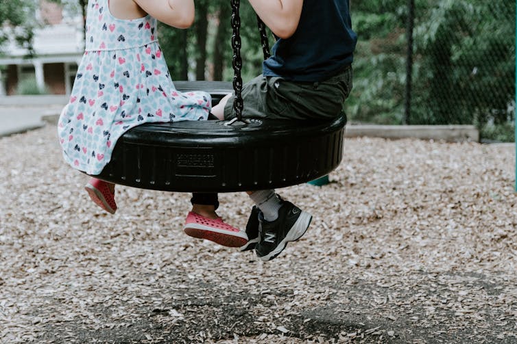 Children on a swing.