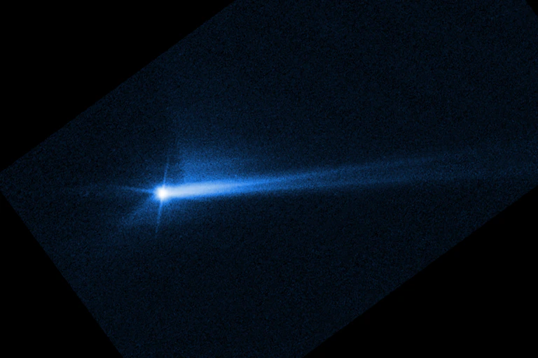 A streak of blue light on a dark background