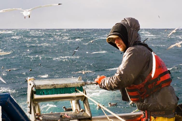 Man uses longline on a boat