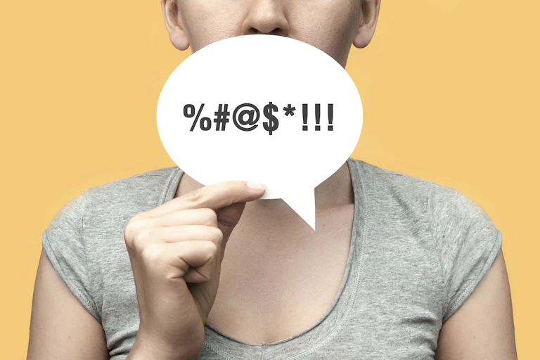 A woman with a conversational cloud in her hand and an obscenity symbol on it.
