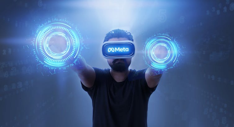 Figure in a headset in a virtual reality space with balls of light at the end of their arms