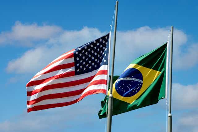 The US and Brazilian flags flying.
