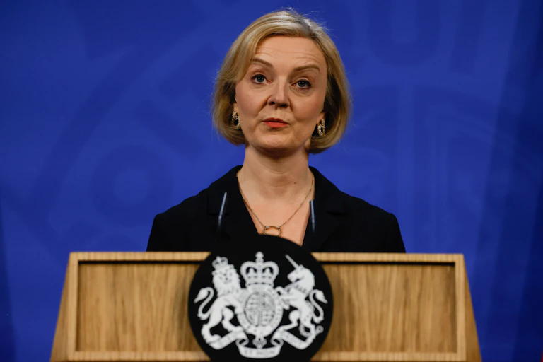 Liz Truss giving a press conference.