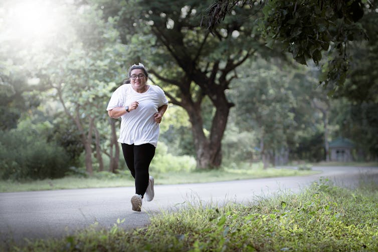 Woman runs on a path